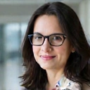 Professional headshot of Dr. Elena Petrova, co-founder and Chief Scientific Officer of VitaVox.