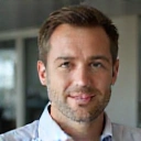 Professional headshot of Mr. Alex Volkov, co-founder and Chief Executive Officer of VitaVox.